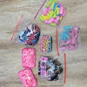 Large lot of hair curlers, ribbons, clips and combs.